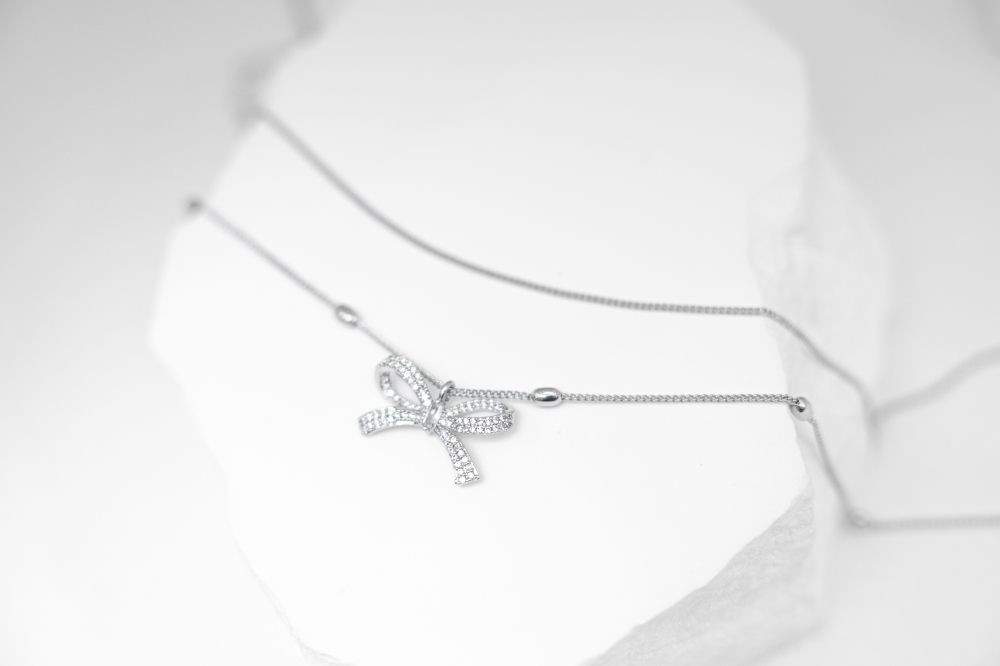 목걸이 橢圓珠墜鋯石蝴蝶結雙層喜平鍊 / 銀色